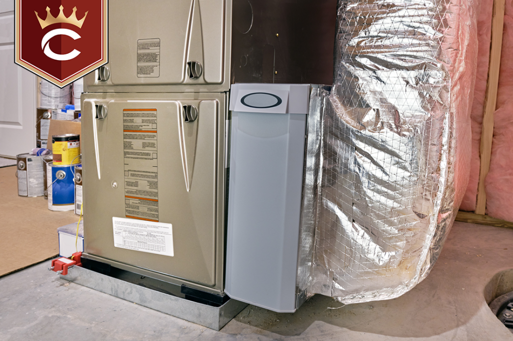 Air filter container between high efficiency furnace and ductwork in a basement utility room